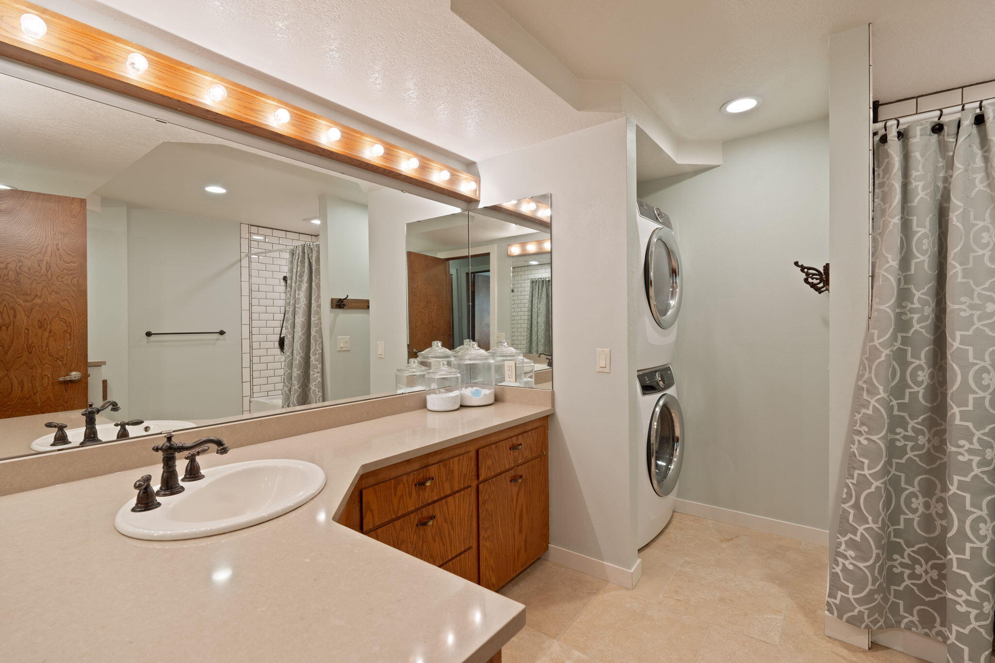 62155 Cody Road Bend, OR 97701 - Photo 29 of 61 a bathroom with a double vanity sink mirror and shower