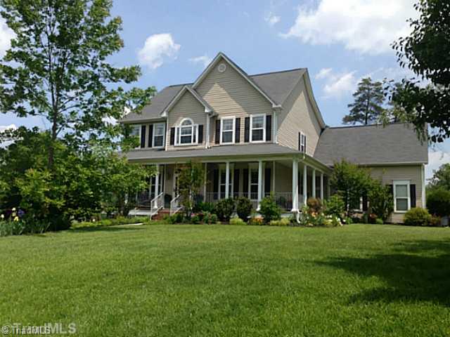 7834 Wilson Farm Road Summerfield, NC 27358 - Photo 1 of 16 Exterior Front. Wrap around one side porch and side entry door to garage from porch. Perfect lot, corner of two cul-de-sacs, low traffic area.