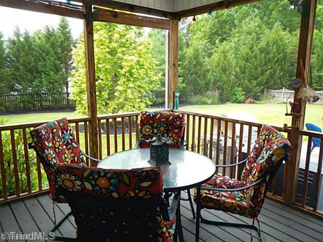 7834 Wilson Farm Road Summerfield, NC 27358 - Photo 13 of 16 Screened Porch. Screened porch with ceiling fan. Gas grill line on patio.