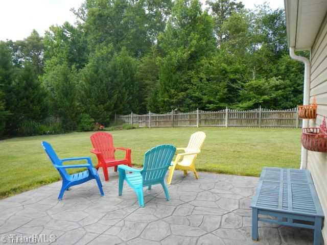 7834 Wilson Farm Road Summerfield, NC 27358 - Photo 16 of 16 Exterior Front. Patio for entertaining, has gas line for grill.
