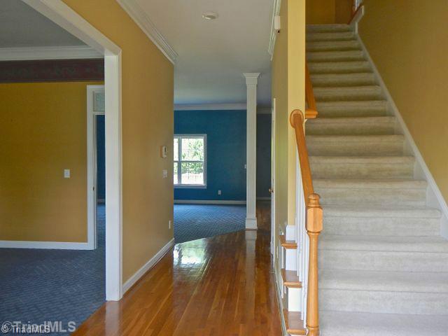 7834 Wilson Farm Road Summerfield, NC 27358 - Photo 6 of 16 Exterior Front. Entry way, living room and formal dining room