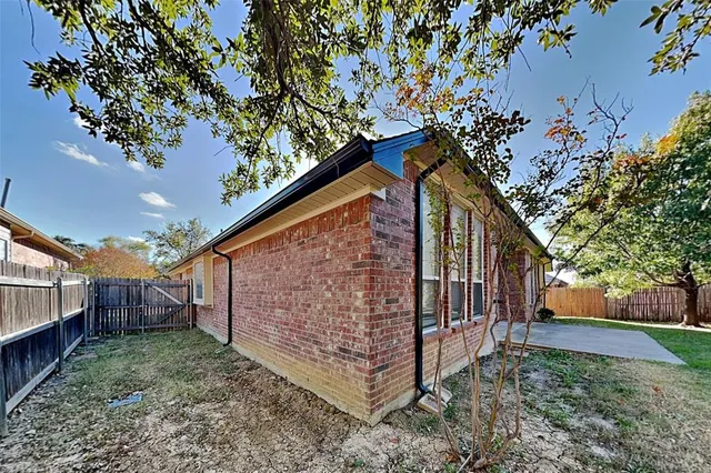 a backyard of a house with lots of green space