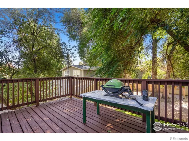 a view of a wooden bench on the deck