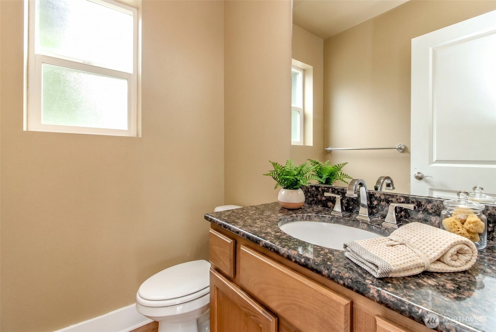 3000 South Mt Baker Boulevard Seattle, WA 98144 - Photo 19 of 40 a bathroom with a granite countertop sink a toilet and mirror