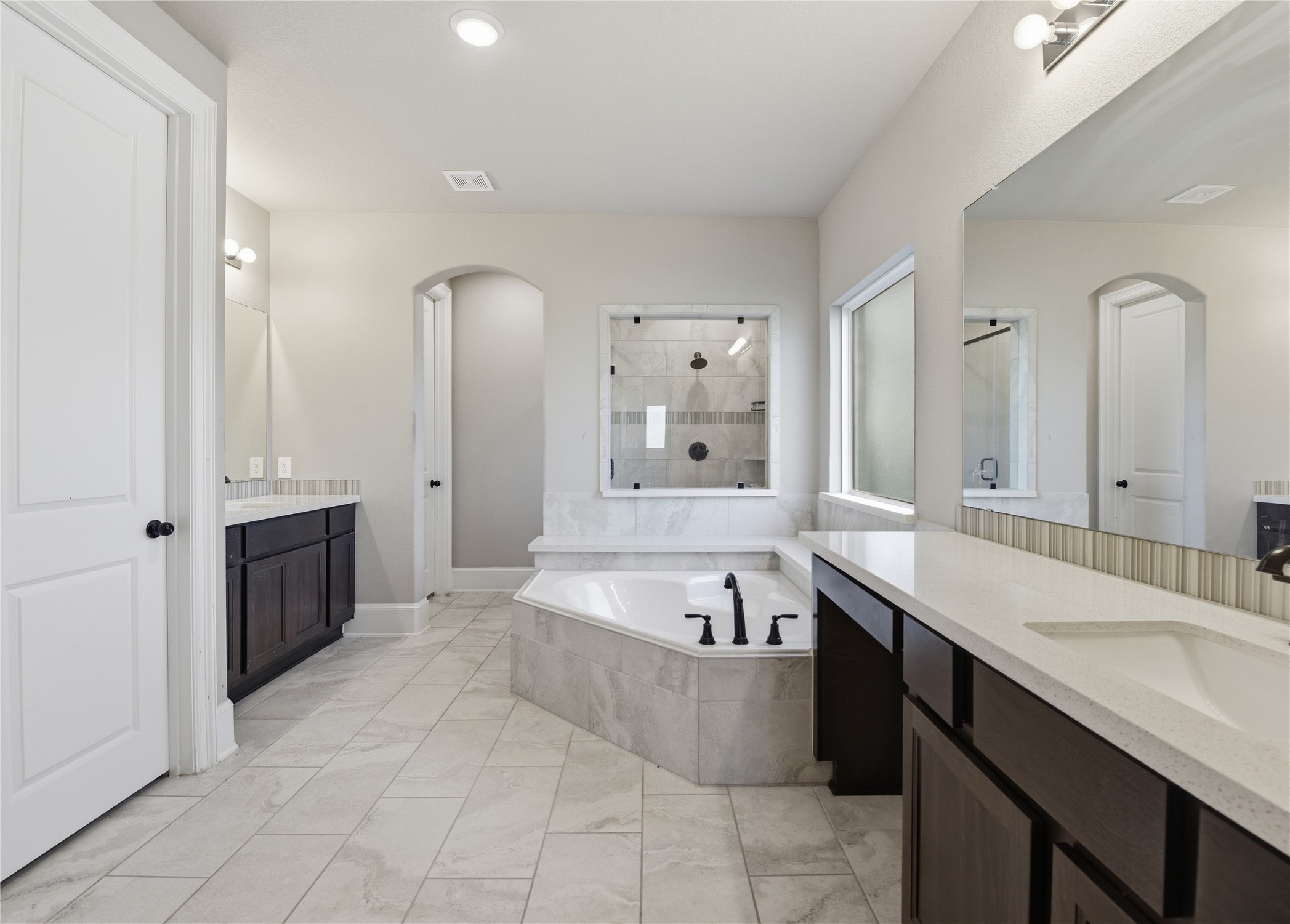 17501 Spice Merlot Lane Conroe, TX 77302 - Photo 28 of 50 a large spacious bathroom with a tub sink and mirror