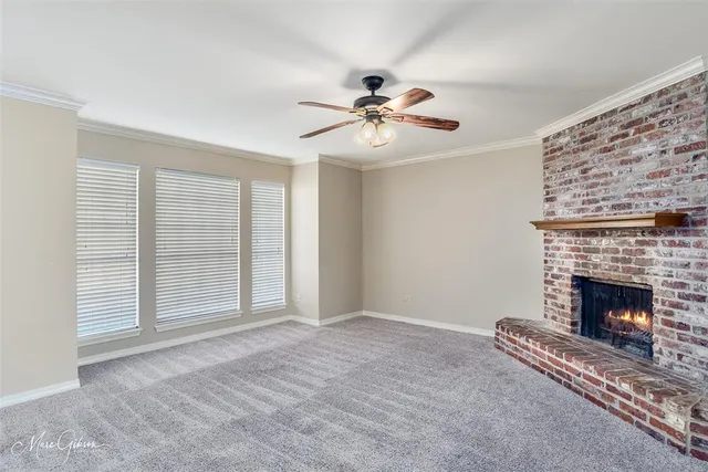 a view of empty room with fireplace