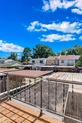 a view of a swimming pool with a lounge chair