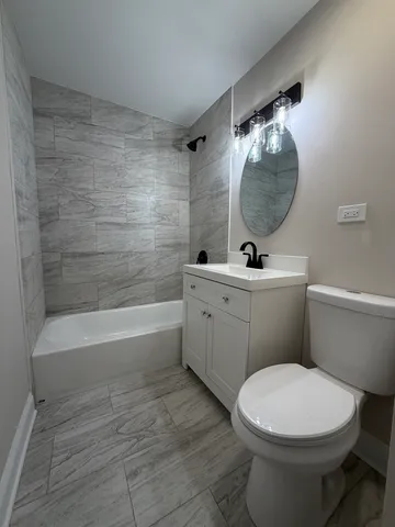 a bathroom with a sink a mirror and a toilet