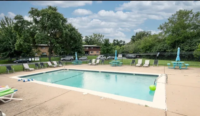 a view of a swimming pool with a patio
