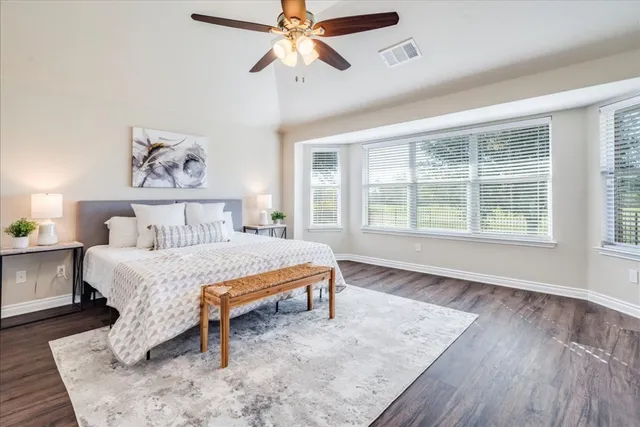 a kitchen with granite countertop a sink a stove and cabinets