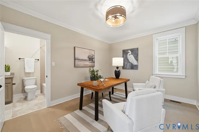 a living room with a table and a window