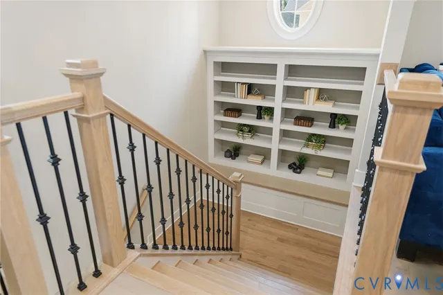 a view of a stairs and an wooden floor