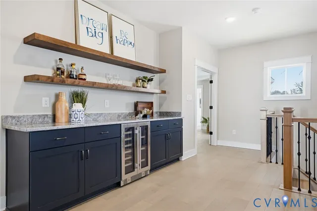 a kitchen with stainless steel appliances a sink and cabinets