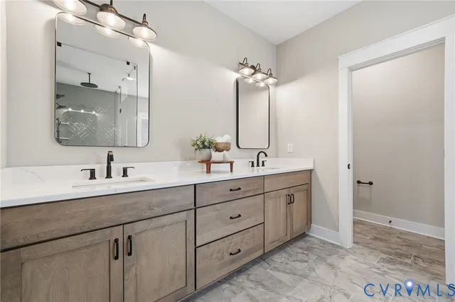 a bathroom with double sink and a mirror