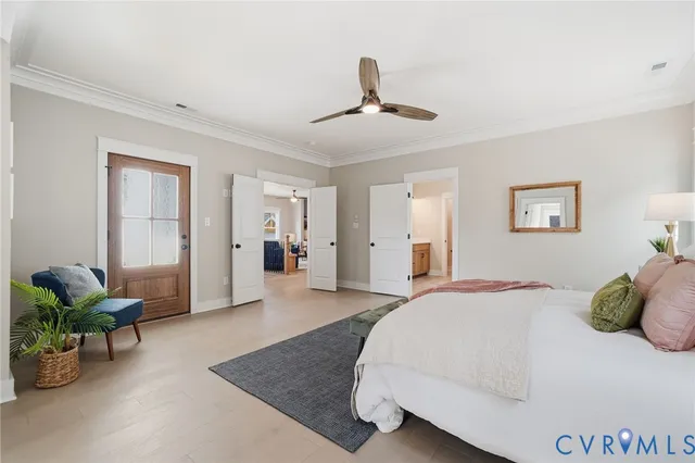 a spacious bedroom with a bed and a couch