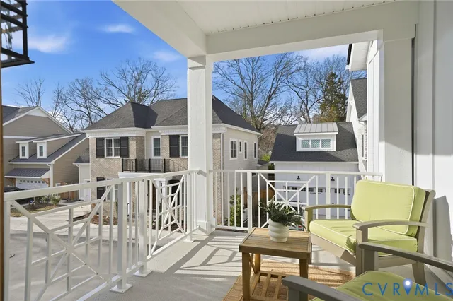 a view of a chairs and a table in the balcony