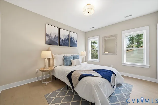 a bedroom with a large bed and a window