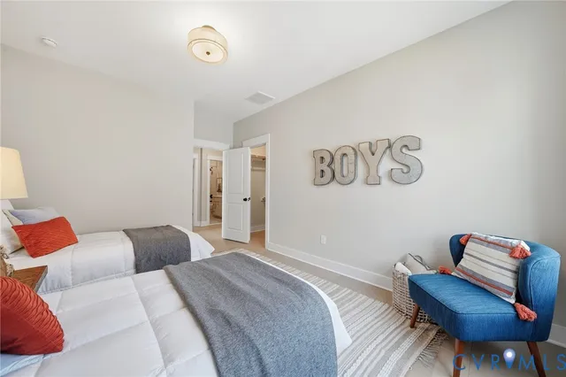 a bedroom with a bed and a chair