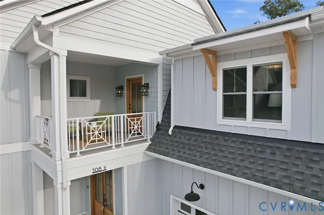 a front view of a house with large windows