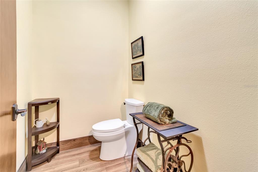 7330 Crabgrass Road St. Cloud, FL 34773 - Photo 25 of 60 a bathroom with a toilet a sink and a mirror