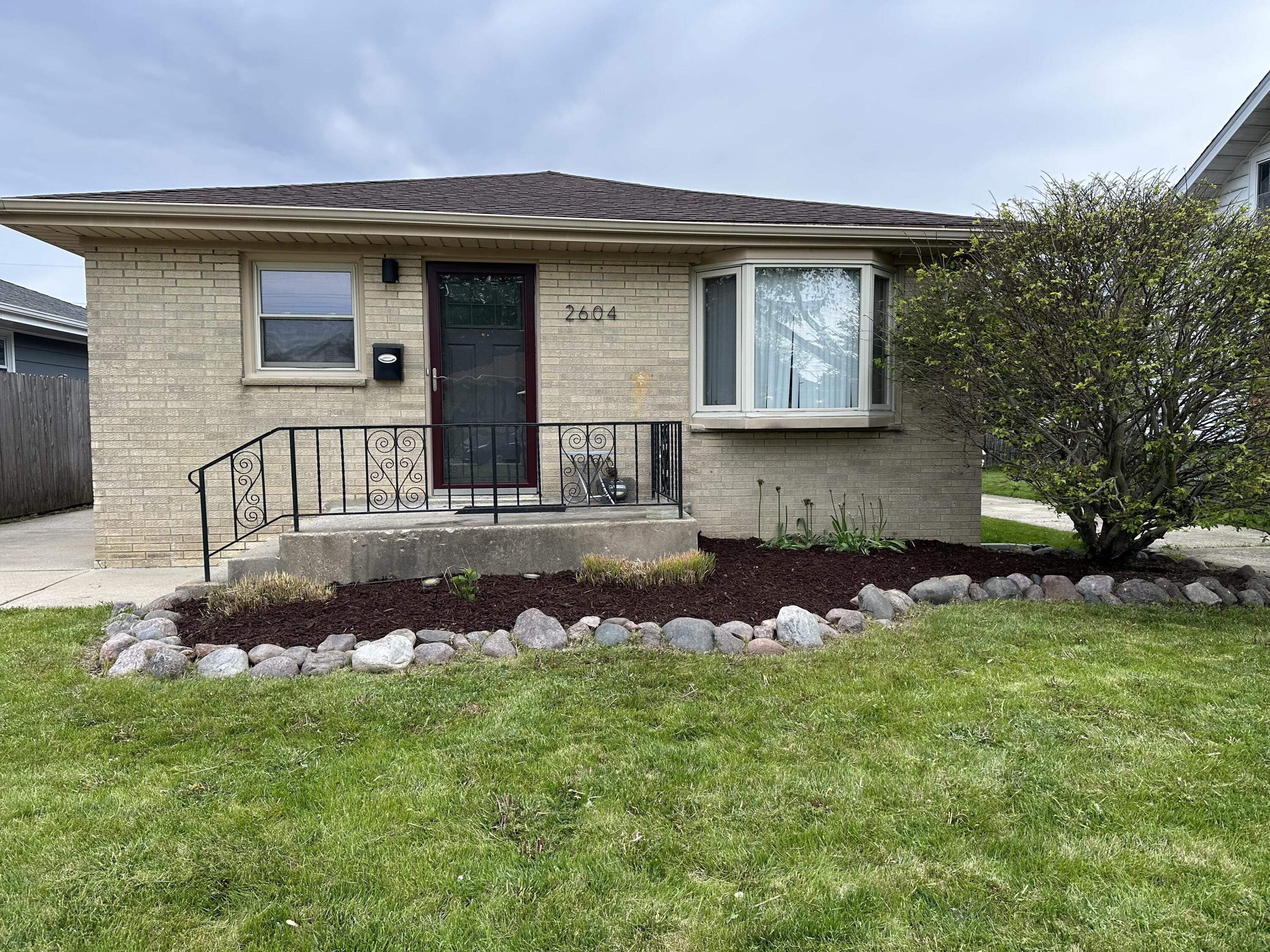 2604 Grove Avenue Racine, WI 53405 - Photo 1 of 1 Beautiful front view of the home in the spring!
