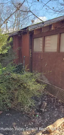 a view of a backyard of the house