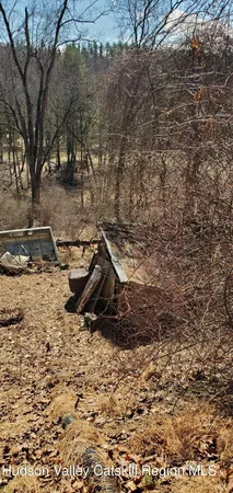 a view of a backyard of the house