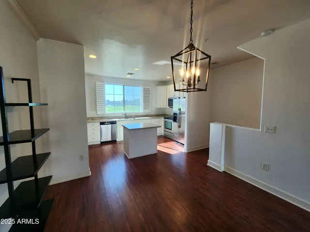 a view of a living room and wooden floor