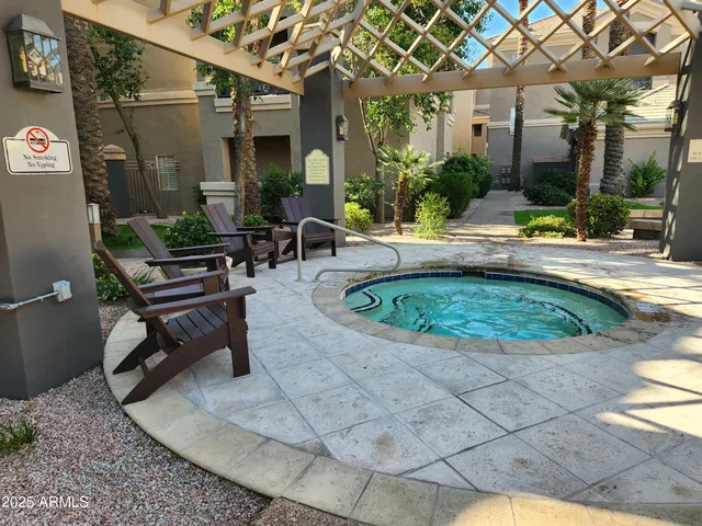 a swimming pool with outdoor seating and yard