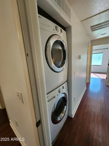 a view of a hallway with washer and dryer