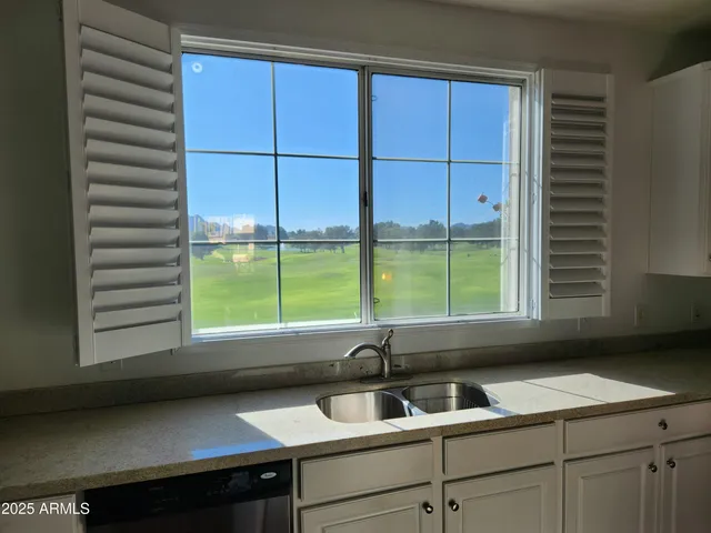 a kitchen with a sink and a window