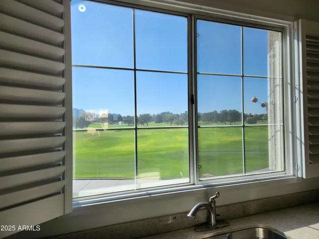 a view of a room with windows and air conditioner