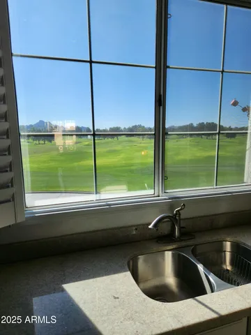 a kitchen view with a sink and pool table