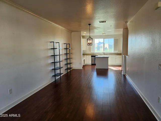 an empty room with wooden floor