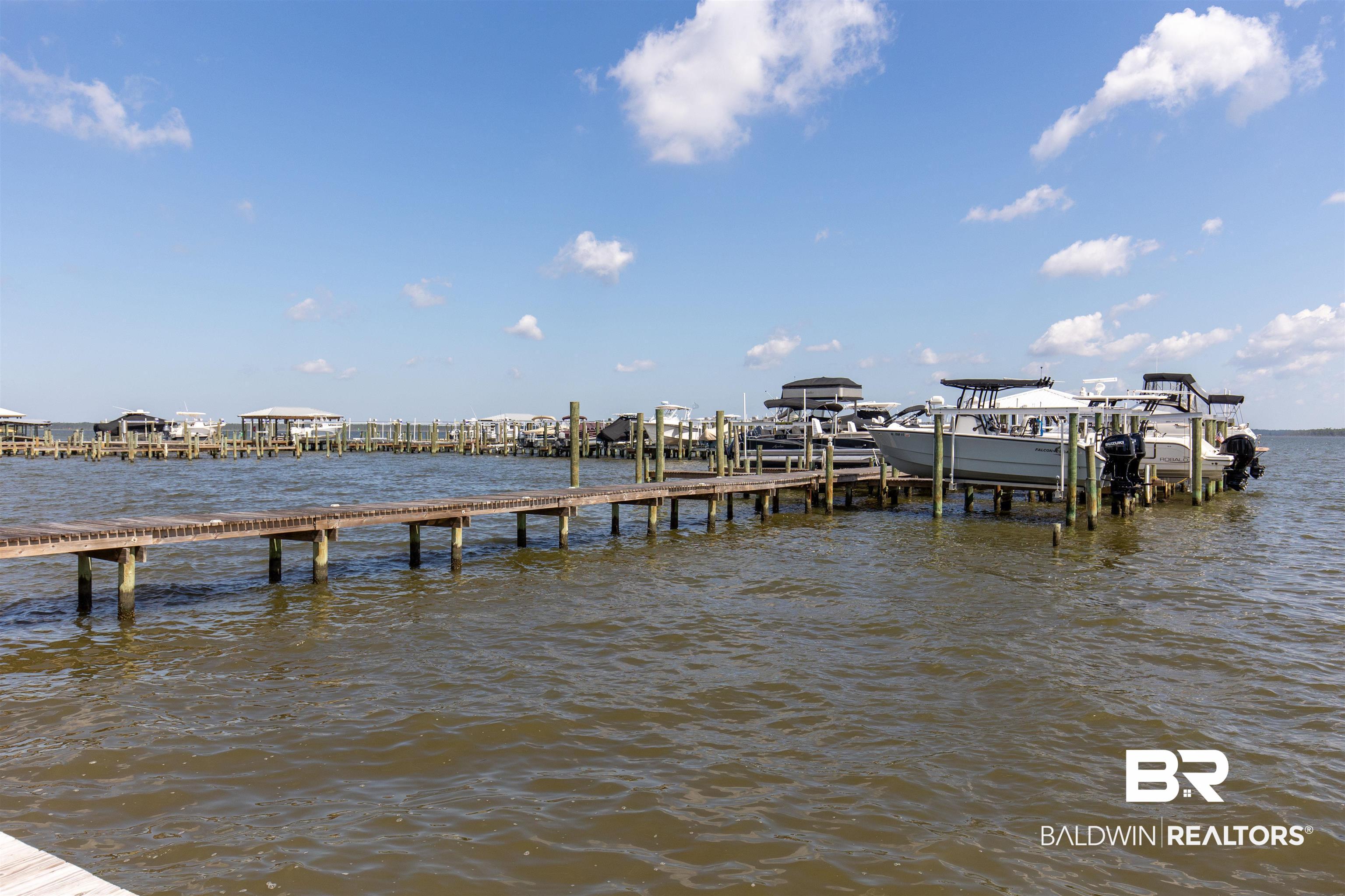 25909 Canal Road, Unit 301 Orange Beach, AL 36561 - Photo 33 of 43 View of dock with a water view