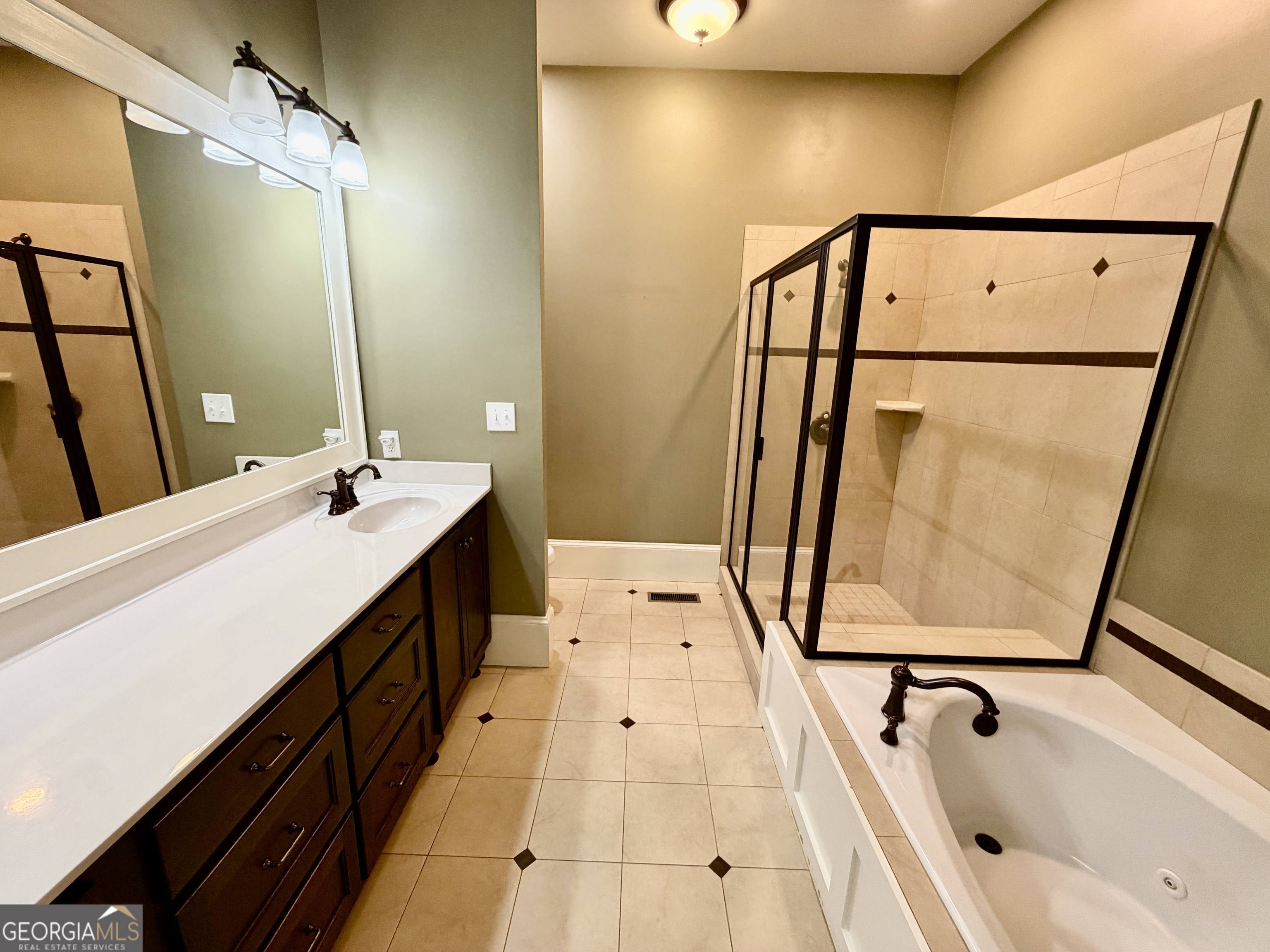 25 Charter Oak Drive Athens, GA 30607 - Photo 15 of 19 a bathroom with a tub sink and mirror