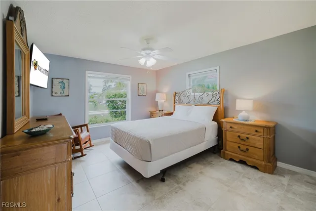 a bedroom with a bed and a desk