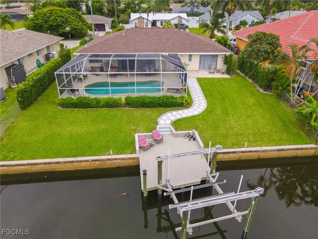 a aerial view of a house with a yard