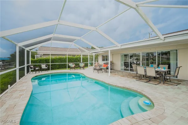 a view of a swimming pool with a porch