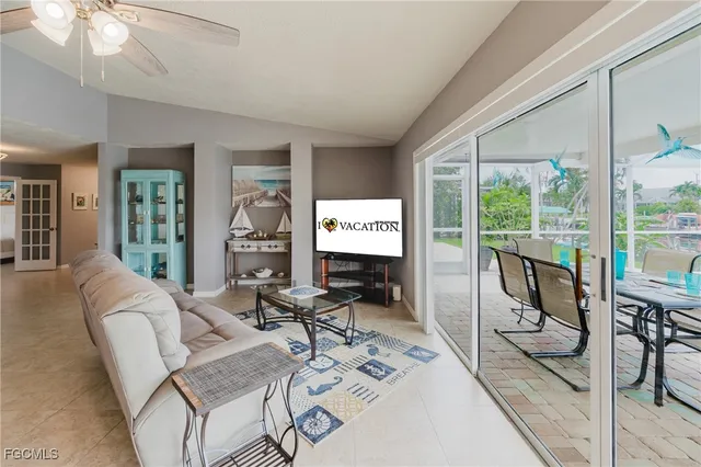 a work room with furniture and large windows