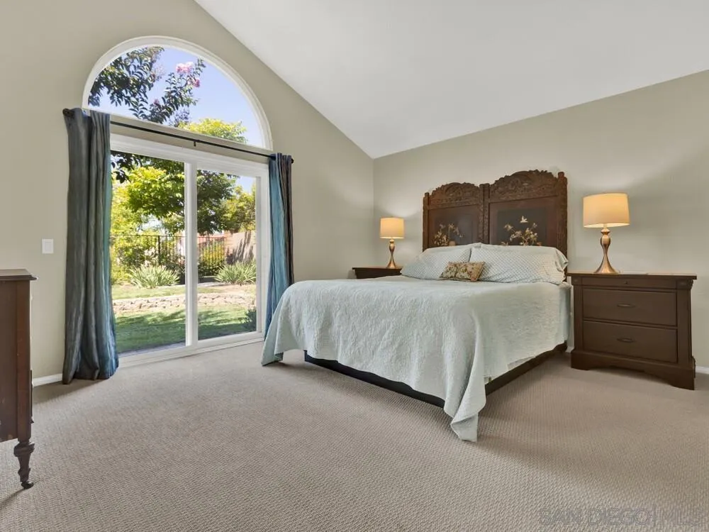 1591 Madrid Drive Vista, CA 92081 - Photo 11 of 40 a bedroom with a bed dresser and a window
