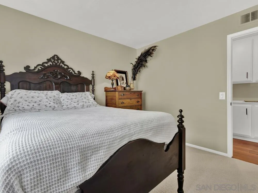 1591 Madrid Drive Vista, CA 92081 - Photo 21 of 40 a bedroom with a bed and cabinets