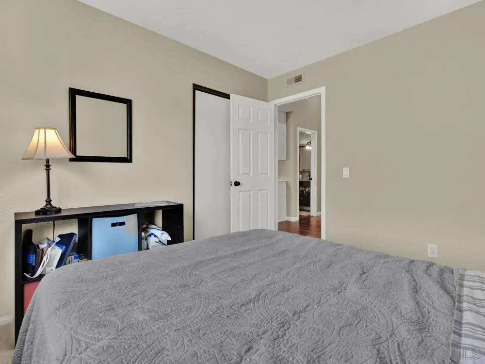 1591 Madrid Drive Vista, CA 92081 - Photo 25 of 40 a view of a bedroom with cabinet and bed