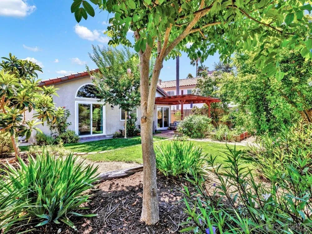 1591 Madrid Drive Vista, CA 92081 - Photo 34 of 40 a front view of a house with a yard and porch