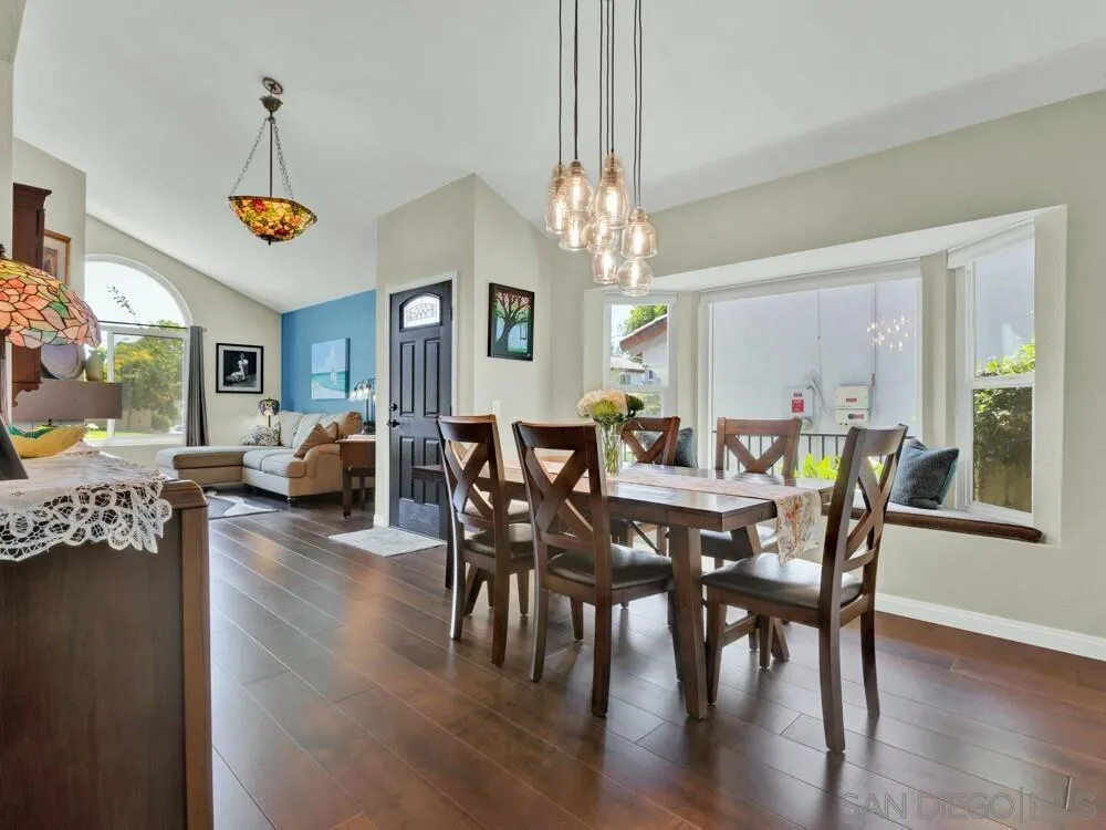 1591 Madrid Drive Vista, CA 92081 - Photo 5 of 40 a view of a dining room with furniture window and wooden floor