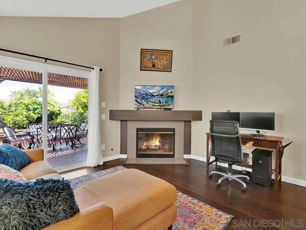 1591 Madrid Drive Vista, CA 92081 - Photo 9 of 40 a living room with furniture and a fireplace