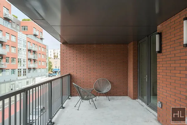 a balcony view with a sink and a window