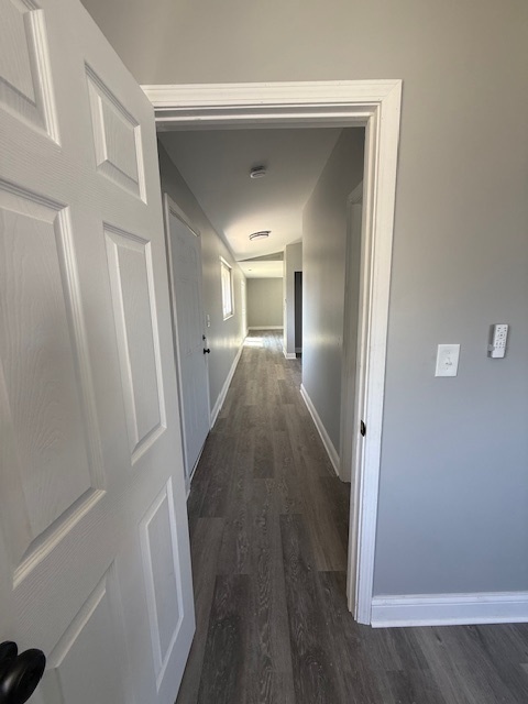 2421 B Lewis Avenue, Unit 2421B Zion, IL 60099 - Photo 7 of 8 a view of a hallway with wooden floor and staircase