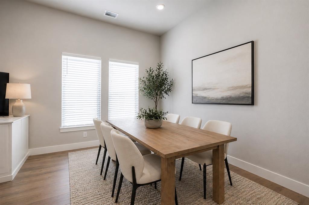 2901 Quinton Street Prosper, TX 75078 - Photo 11 of 27 a view of a dining room with furniture and wooden floor