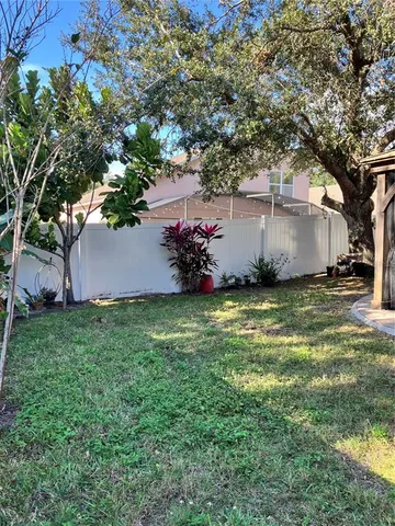 a kitchen with stainless steel appliances granite countertop a refrigerator and a stove